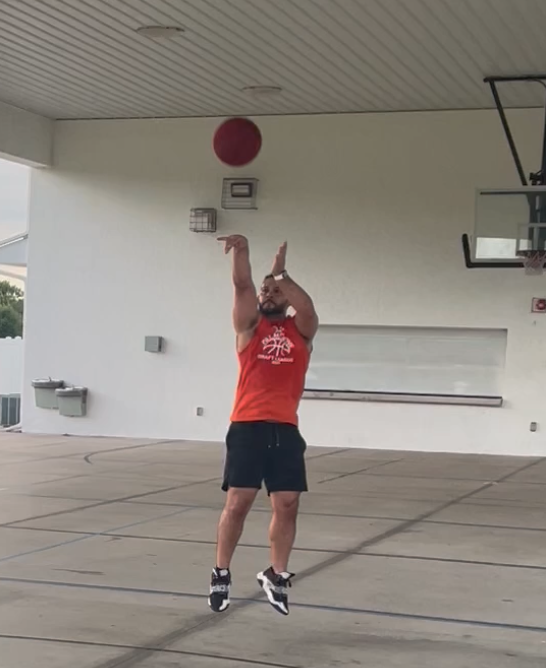 Sam Rosario shooting a basketball during training